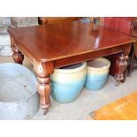 A Victorian mahogany extending dining table, (two spare leaves, 49cm and 56cm) octagonal baluster
