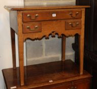 A George III oak lowboy, W.77cm