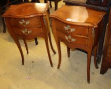 A pair of Louis XV style serpentine fronted two drawer kingwood chest, on slender cabriole legs, W.