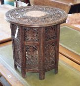 An Indian vineous carved hardwood occasional table, diameter 46cm