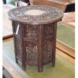 An Indian vineous carved hardwood occasional table, diameter 46cm