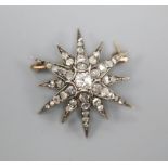 An Edwardian gold and diamond starburst brooch pendant, 3cm