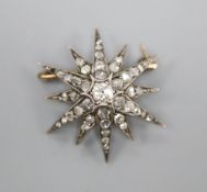 An Edwardian gold and diamond starburst brooch pendant, 3cm