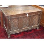 A 17th/18th century carved and panelled oak coffer, W.120cm