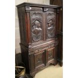 A late 19th century Flemish carved and varnished oak four door cupboard, fitted one drawer, W.