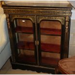 A 19th century ebony and boulle work two door glazed display cabinet, with ormolu mounts, W.105cm,