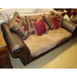 A brown leather upholstered settee, with fabric upholstered cushion seats, W.220cm