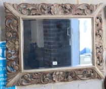 A 19th century Flemish painted and carved oak wall mirror, W.82cm, H.62cm