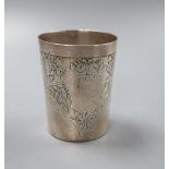 A French white metal tumbler cup, decorated with flowers and butterflies, 7.5cm