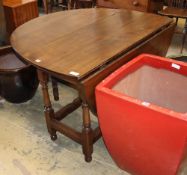 An 18th century oak gateleg table (re-tipped), W.122cm