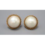 A pair of 18k gold mounted mabé pearl earrings, diameter 2.25cm