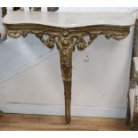 A 19th century French carved giltwood and gesso console table with serpentine marble top, W.94cm