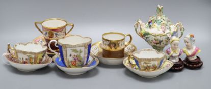 Four gilt decorated cabinet cups and saucers, a floral encrusted pot, height 15cm and two busts on