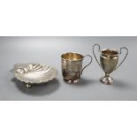 A Victorian silver christening can "Marie", a George V scallop shell dish and a small trophy cup,