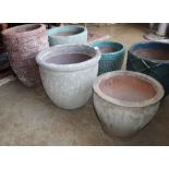 Three assorted glazed pottery garden planters, tallest 54cm