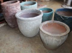 Three assorted glazed pottery garden planters, tallest 54cm