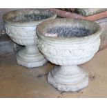A pair of composition garden urns, diameter 44cm, H.43cm