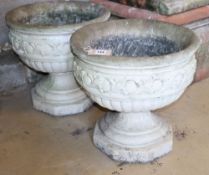 A pair of composition garden urns, diameter 44cm, H.43cm