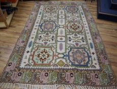 A Caucasian design ivory ground rug, 320 x 195cmCONDITION: One cigar burn and one small patch of
