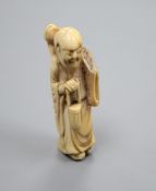 An 18th century Japanese netsuke of Gama Sennin, height 7cm