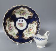 An 18th century Worcester blue scale plate, diameter 19.5cm and a sauceboatCONDITION: The plate