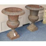 A pair of cast iron campana-shaped urns, H.76cm, Diameter 55cm