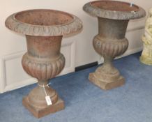 A pair of cast iron campana-shaped urns, H.76cm, Diameter 55cm
