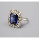 A platinum synthetic sapphire and diamond octagonal cluster ring, size O