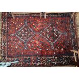 A Qashqai red ground rug, 140 x 110cm