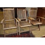 Three teak folding garden armchairs