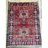 A Heriz red ground rug, 130 x 96cm