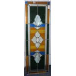 A stained glass panel, 38 x 106cm