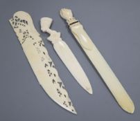 An ivory and pique work 'fist' page turner and two paper knives