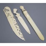 An ivory and pique work 'fist' page turner and two paper knives