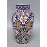 An early 20th century Isnik style pottery vase, height 34cm