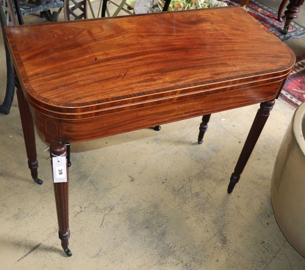 A Regency rosewood banded mahogany folding card table, W.86cm, D.43cm, H.73cm