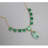 A green stone set necklace, the chain stamped '18ct'