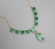 A green stone set necklace, the chain stamped '18ct'