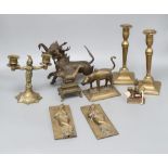 A quantity of mixed metalware including a pair of Indian deities, a pair of candlesticks and a