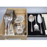 A pair of silver plated candlesticks, a coaster, box cutlery etc