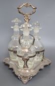 A plated three decanter tantalus of triangular form with leaf-wrapped handle, with bottles and