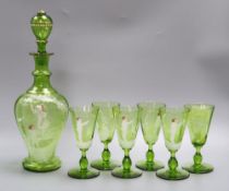 A Victorian 'Mary Gregory' decorated green glass decanter, height 33cm and six tumblersCONDITION: