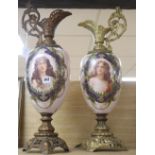 A pair of spelter-mounted porcelain ewers, height 64cm