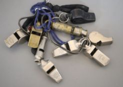 A collection of nine whistles