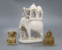 An Indian white marble elephant group, height 22cm and two soapstone elephants