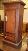 A 19th century mahogany banded oak pedestal bedside cupboard (converted from a longcase clock