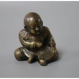 A Japanese bronze figure of a seated boy, height 5cm