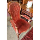 A Victorian mahogany spoonback armchair