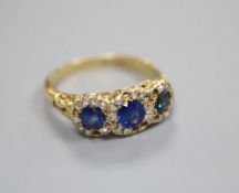 A Victorian 18ct gold sapphire and diamond ring, finger size R/S, lacking some small diamonds