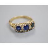 A Victorian 18ct gold sapphire and diamond ring, finger size R/S, lacking some small diamonds